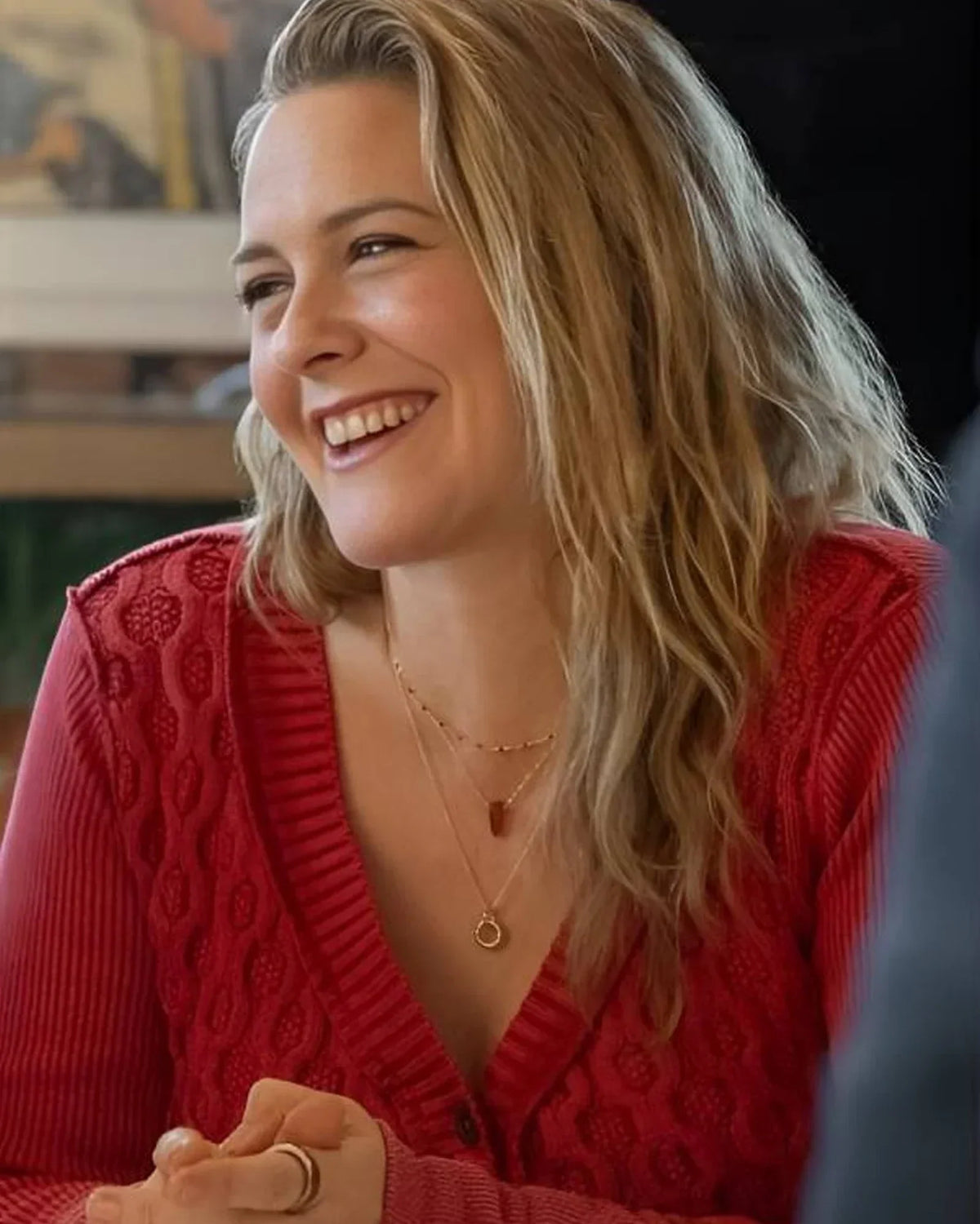 A-Merry-Little-Ex-Mas-2025-Alicia-Silverstone-Red-Cardigan